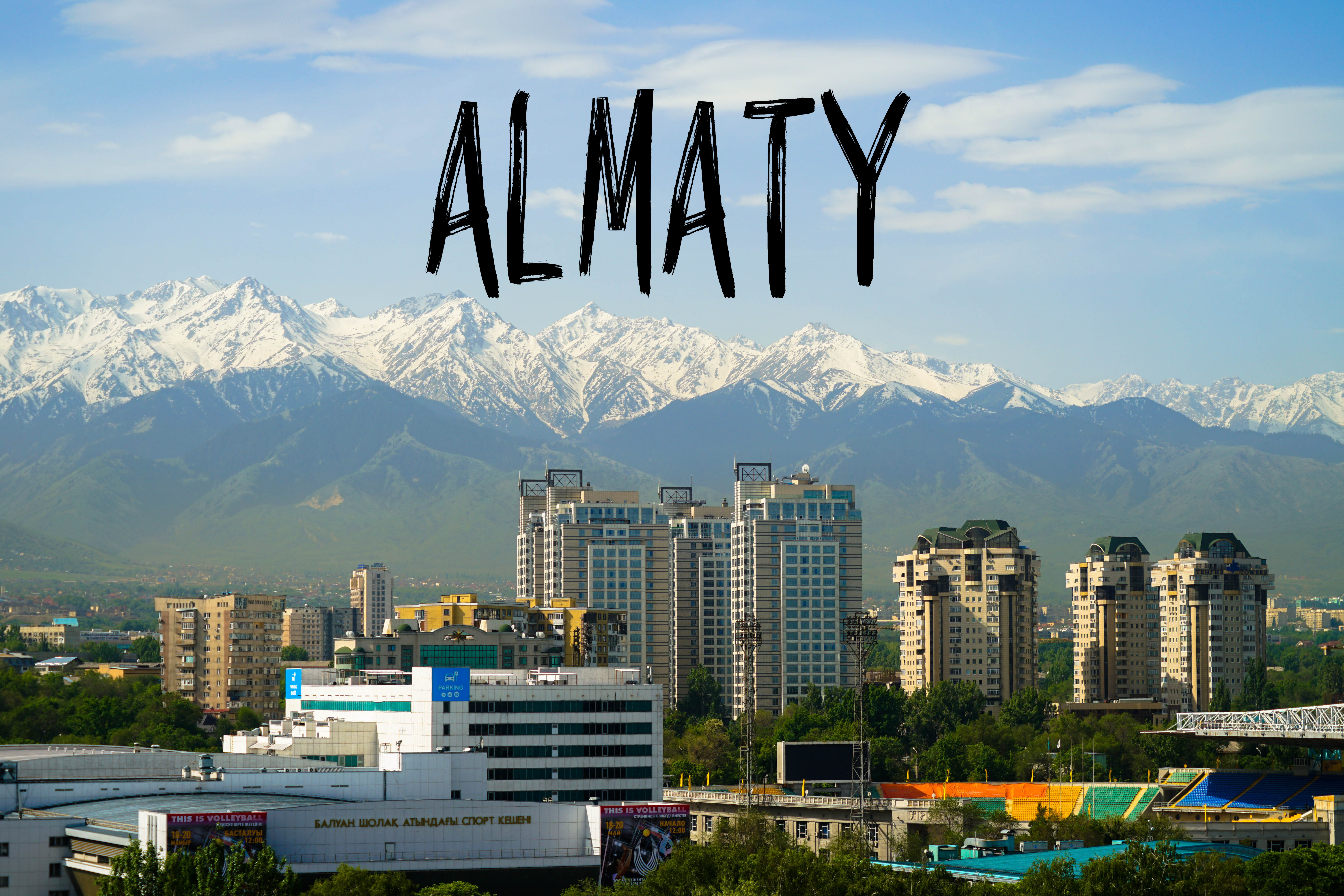 Almaty city view with text overlay Almaty