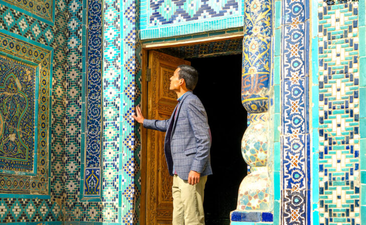 Tourist looking at blue tiles in Samarkand