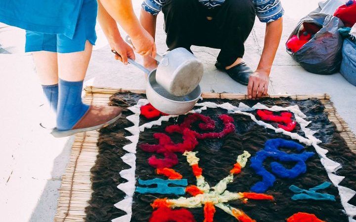Kyrgyz felt making carpets in Kochkor