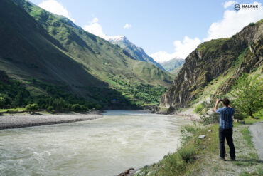 Traveller taking picture in Pamir Highway